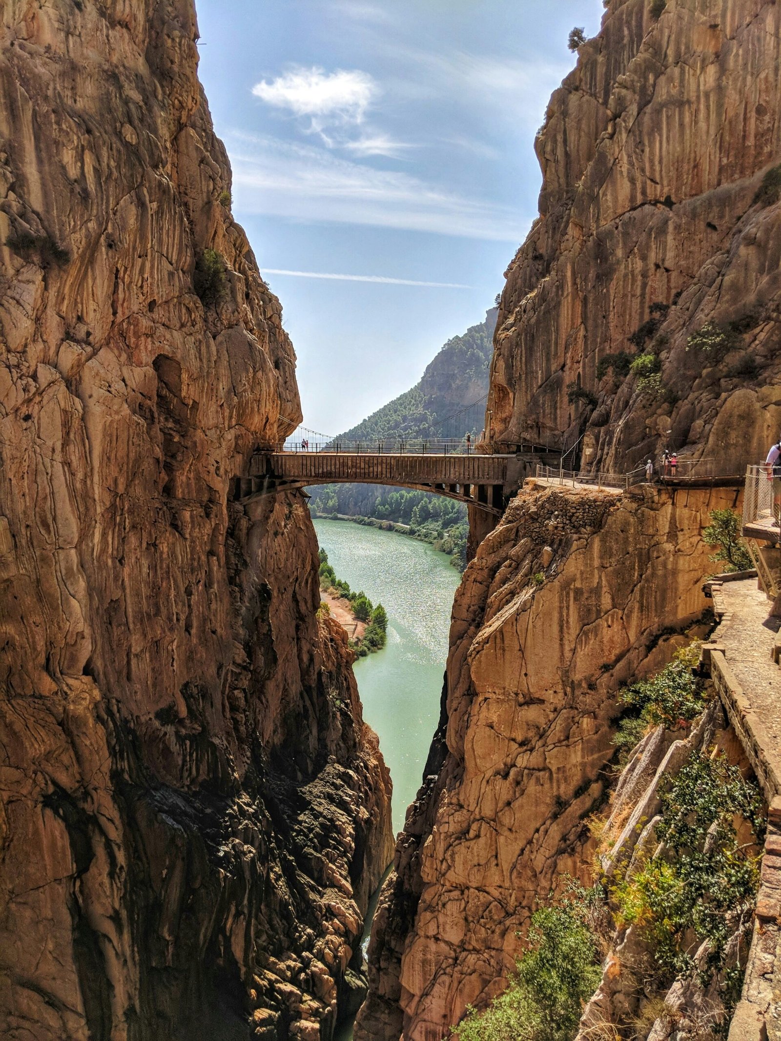 Hikers on the Caminito del Rey walkway through the Gaitanes Gorge