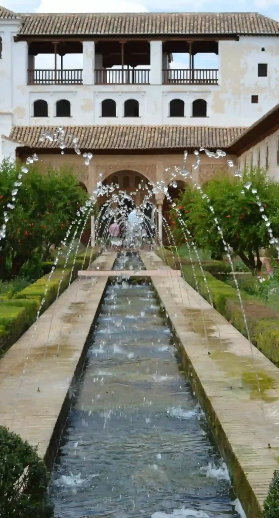 Generalife Gardens with fountains and hedges in the Alhambra, Granada